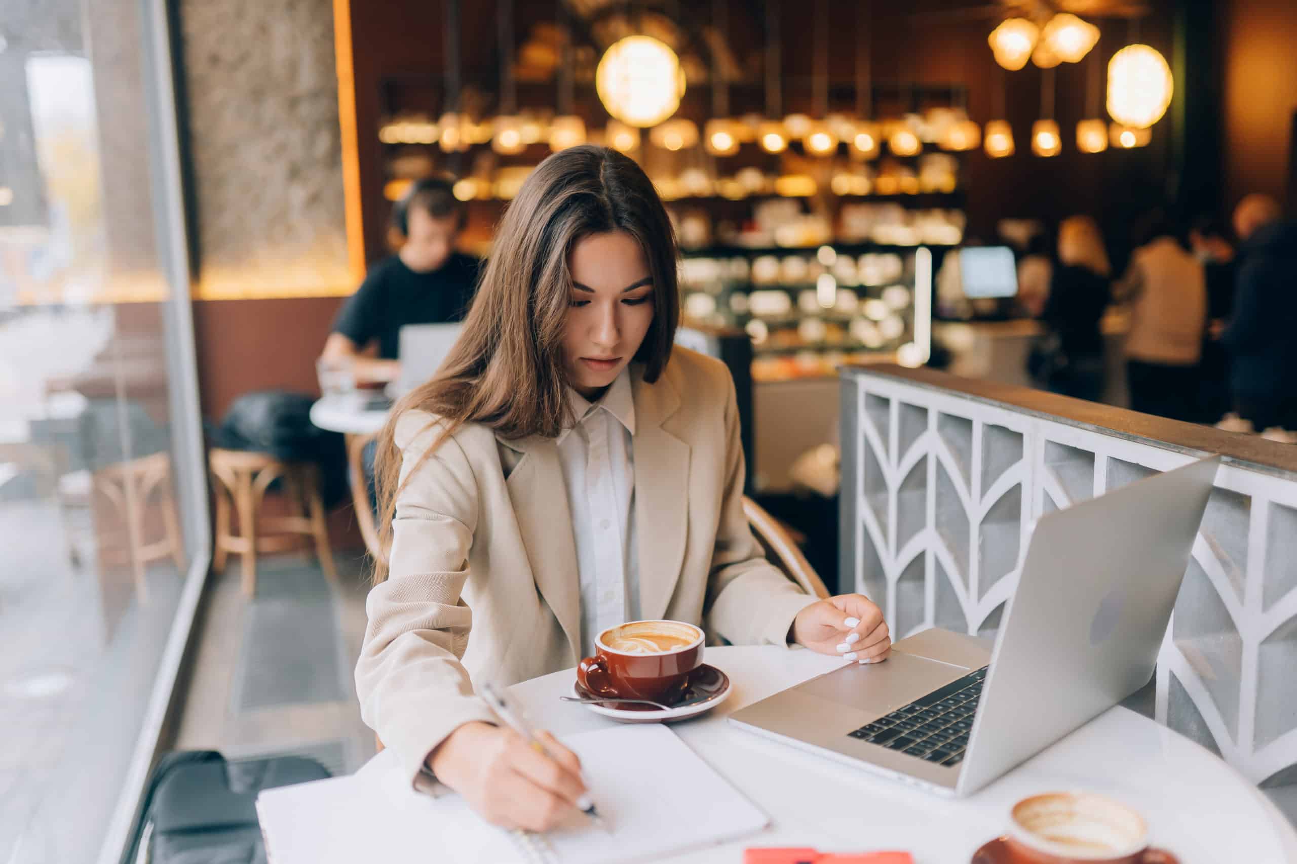 Young lady browsing the Internet at the cafe