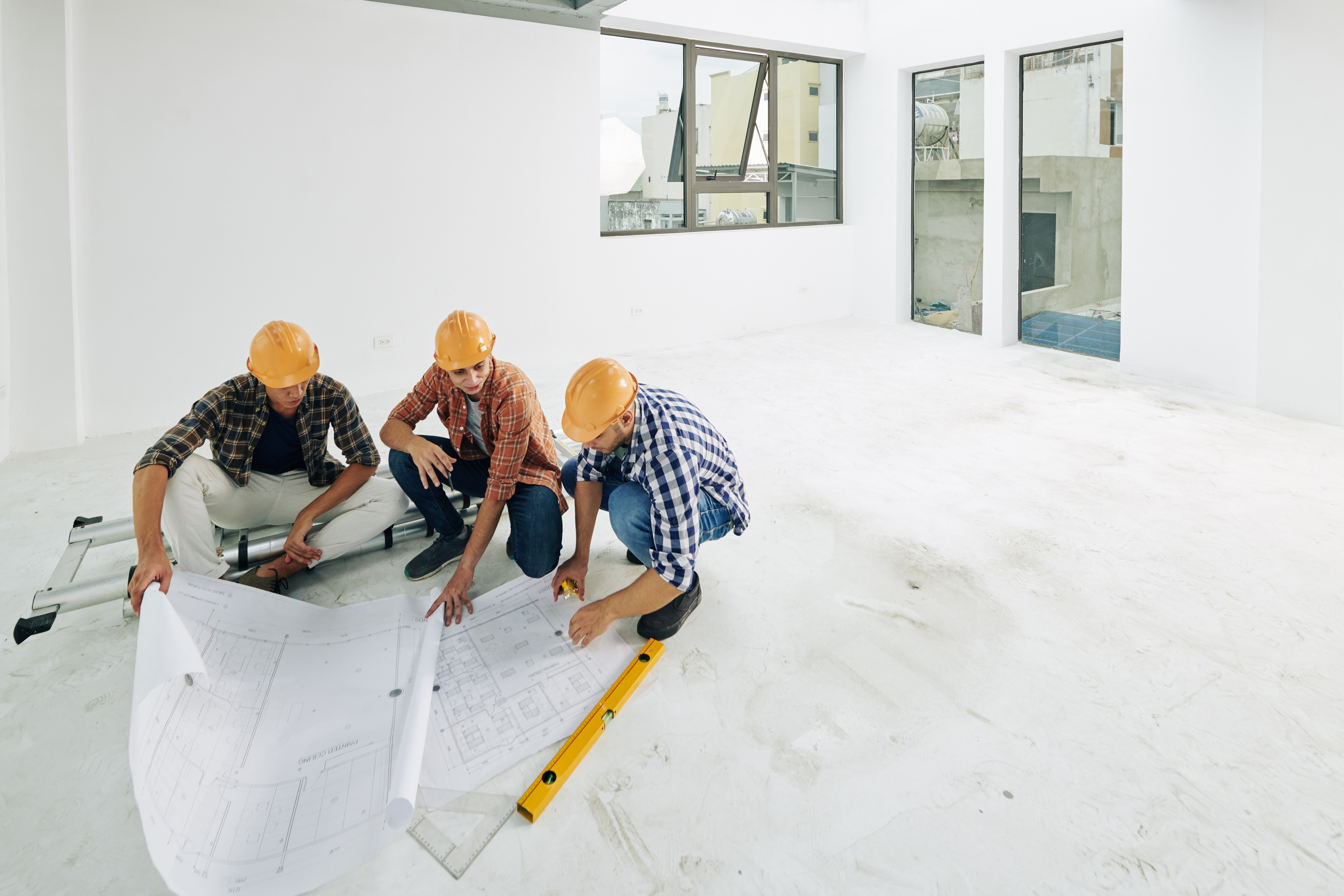 Builders checking blueprints