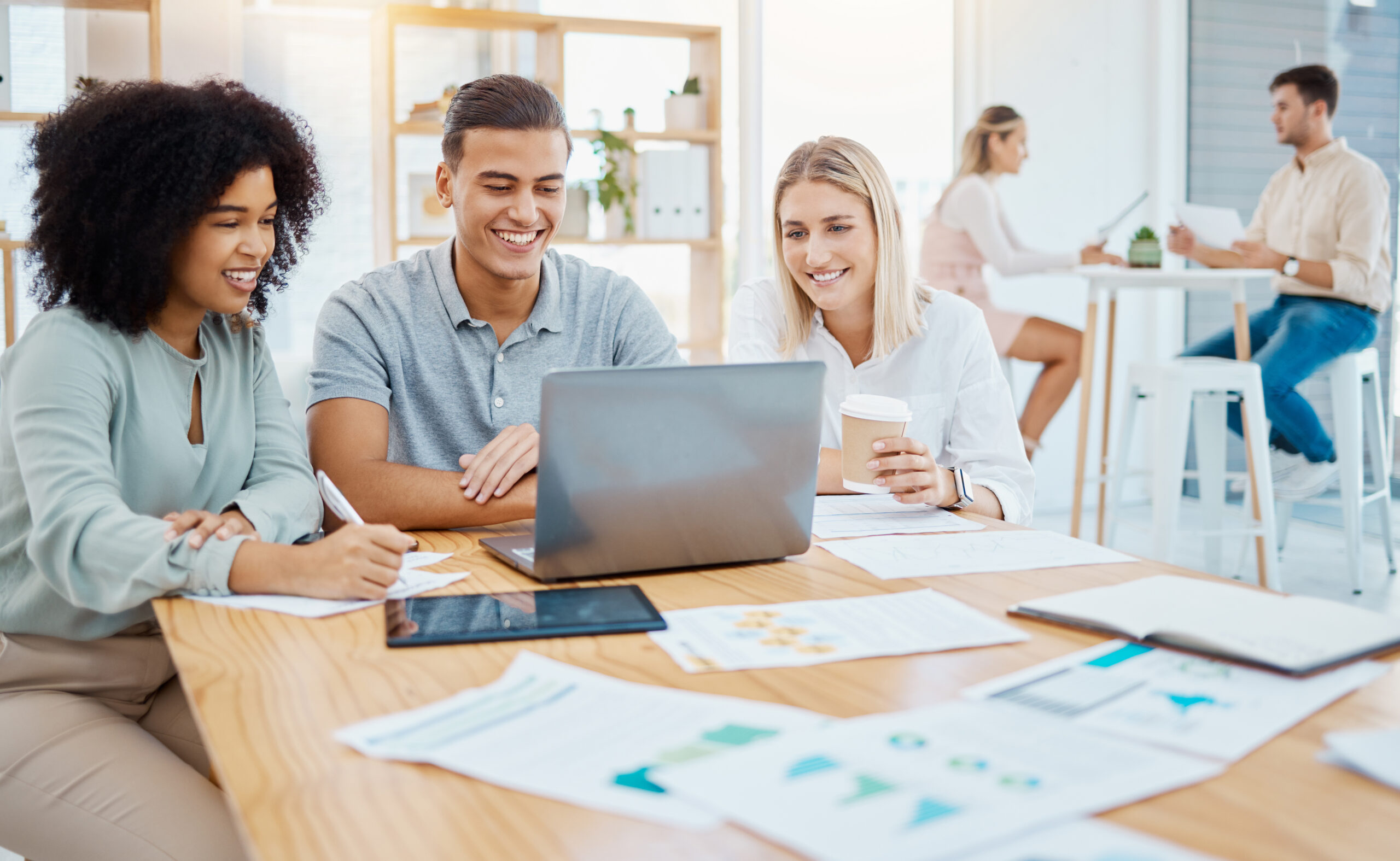 happy-business-people-working-on-a-laptop-in-a-cor-2022-12-07-22-10-56-utc