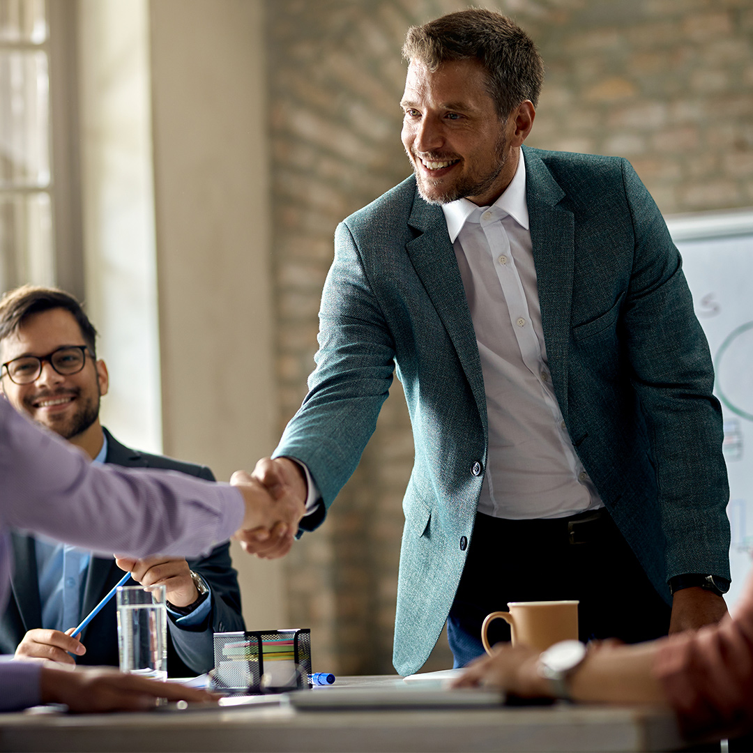 Man shaking hand with other after a meeting on how to remove public records from the internet