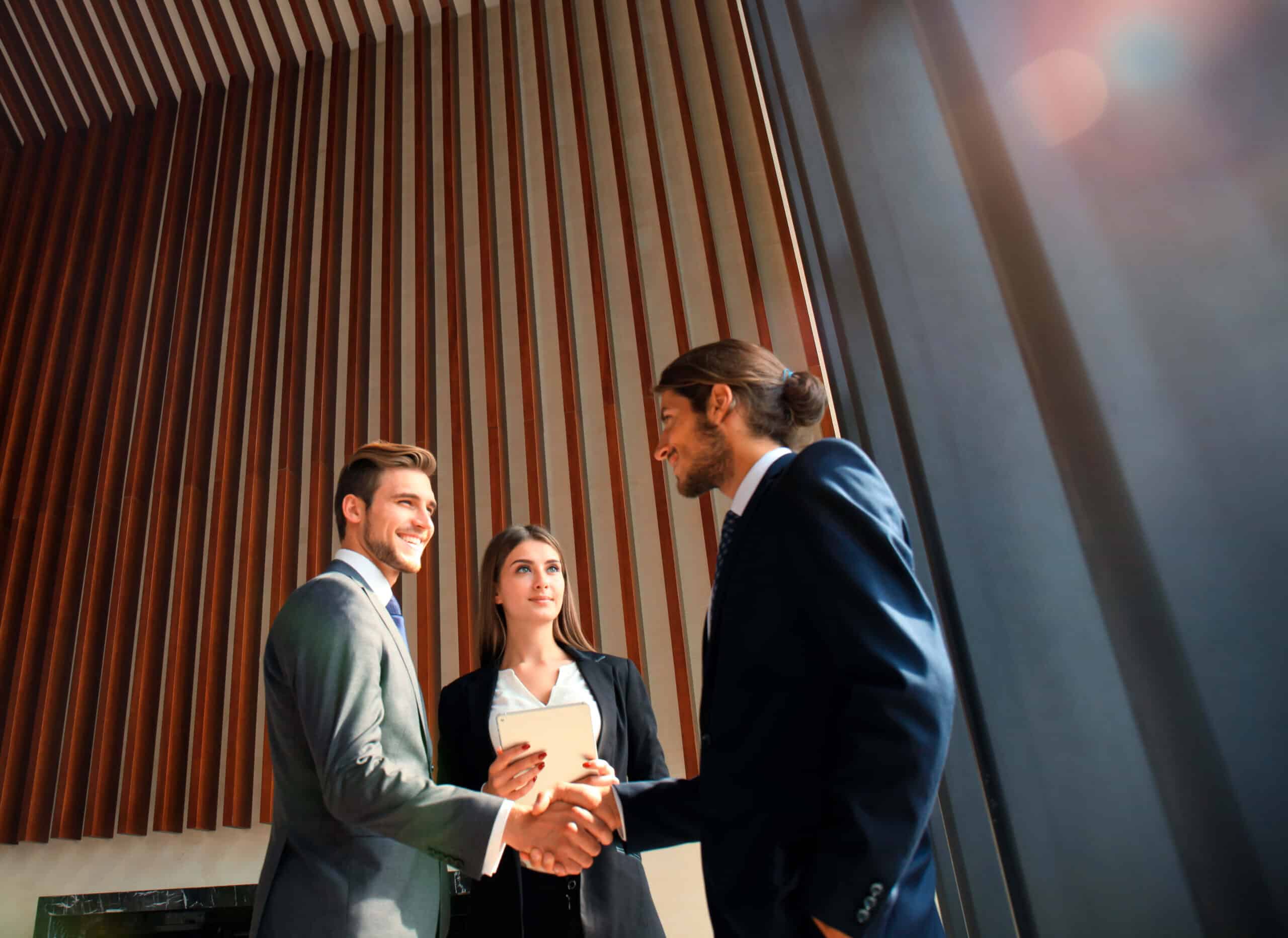 Two men shaking hands after a successful Removal Listing From Whitepages